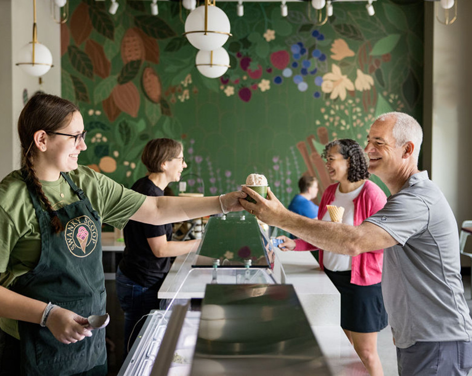 A family enjoying a scoop of ice cream at Swanky Scoop