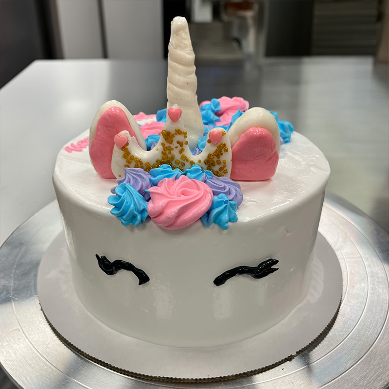Unicorn decorated ice cream cake